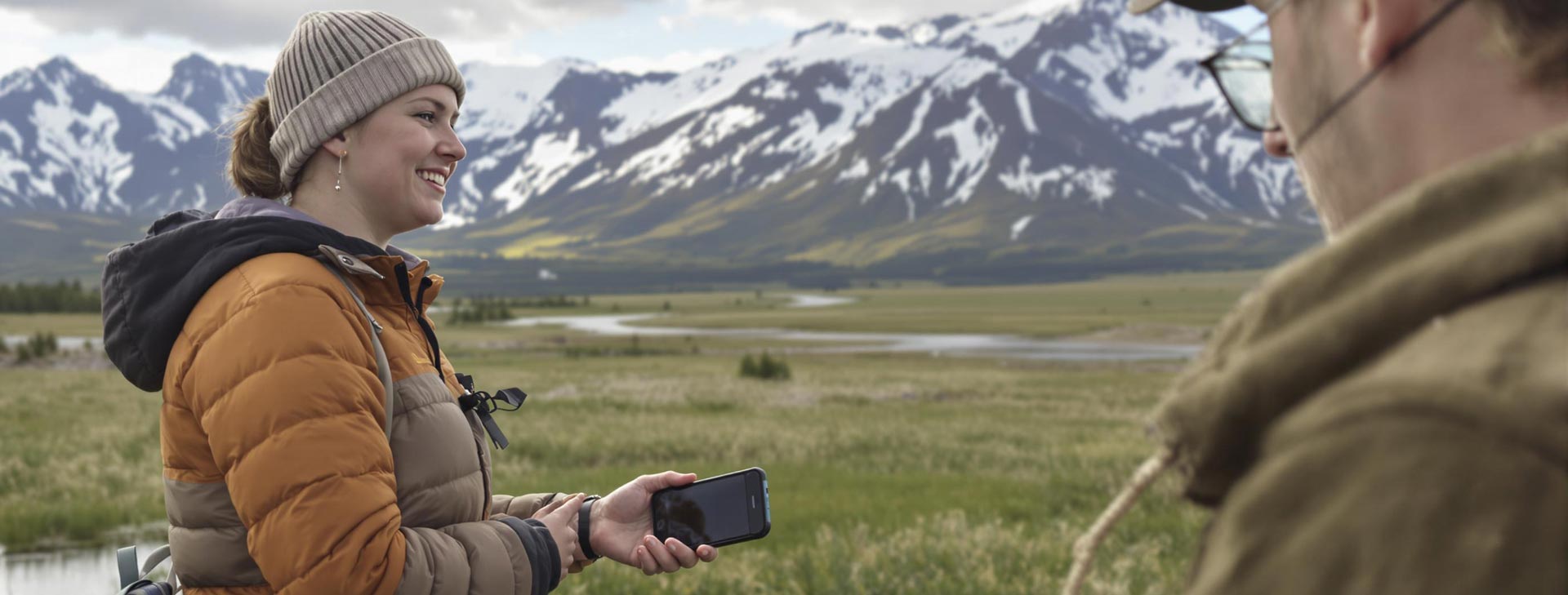 envato-labs-ai-3ffda02e-e389-4ccb-bff0-26ed5dc31b9d People in front of mountains